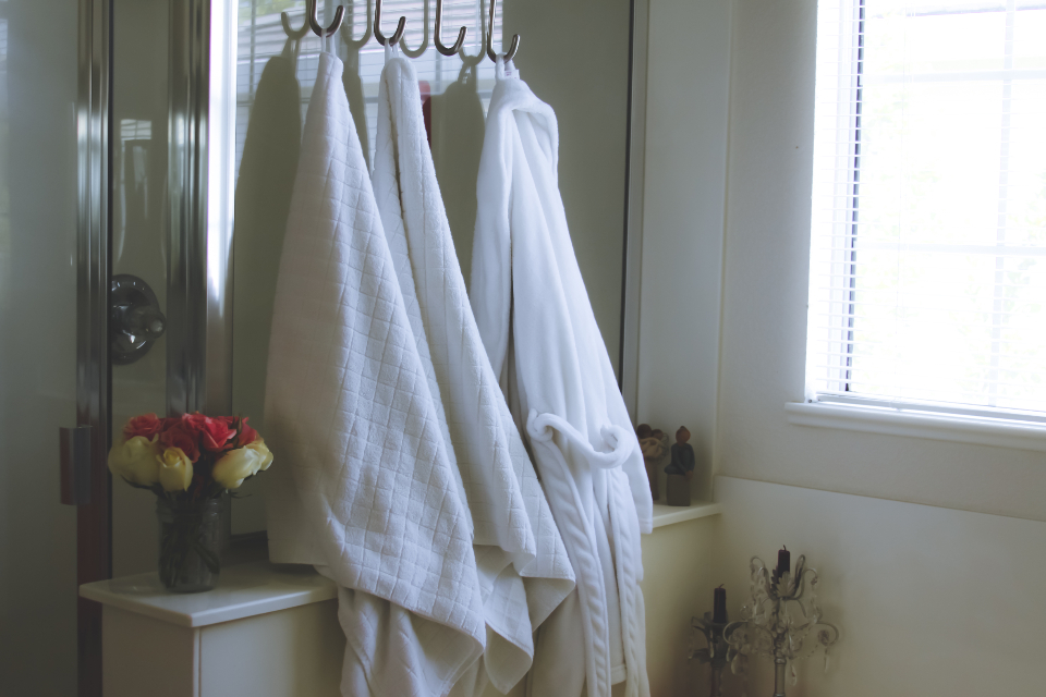 Fresh linen and robes stored ready for the next room turn